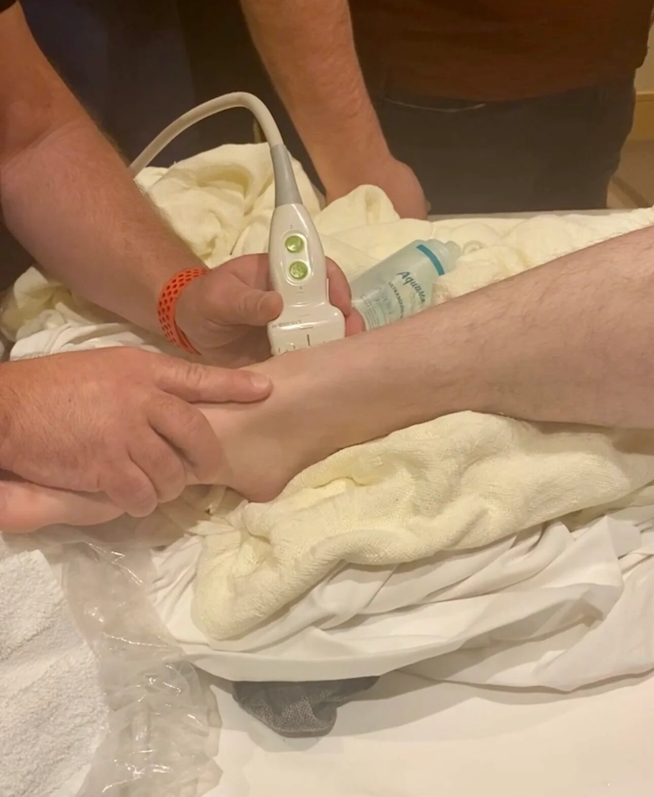 A foot therapy session using a comforter machine.