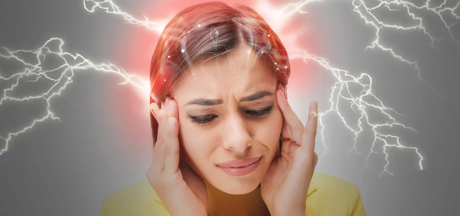 A black-and-white image of a girl’s head with red spots and shocking currents indicating headache pain.